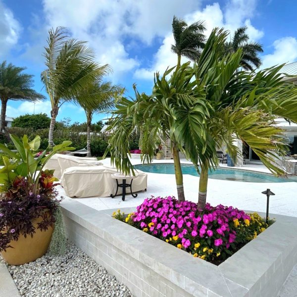 Retaining Walls and Annual Beds with potted plants | Love's Landscape Landscape Installation & Maintenance Company