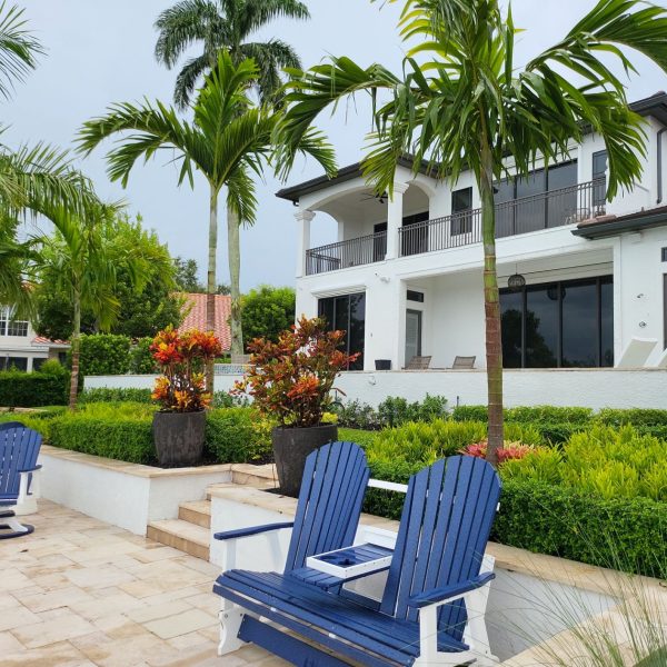 Whole Yard Landscape Renovation by Love's Landscape with Pavers, Stone, Artificial Turf, Large Palms & colorful plants